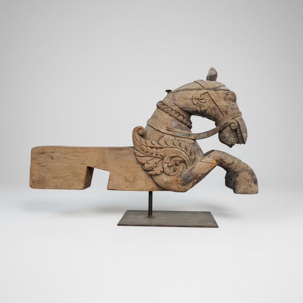 A 19th century carved wood pegasus fragment, likely once part of an architectural or processional element, with an expressive winged form and weathered surface.