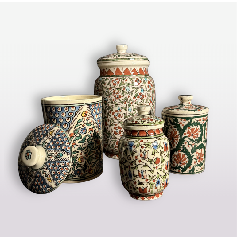 vintage handmade canister set of four with floral motif