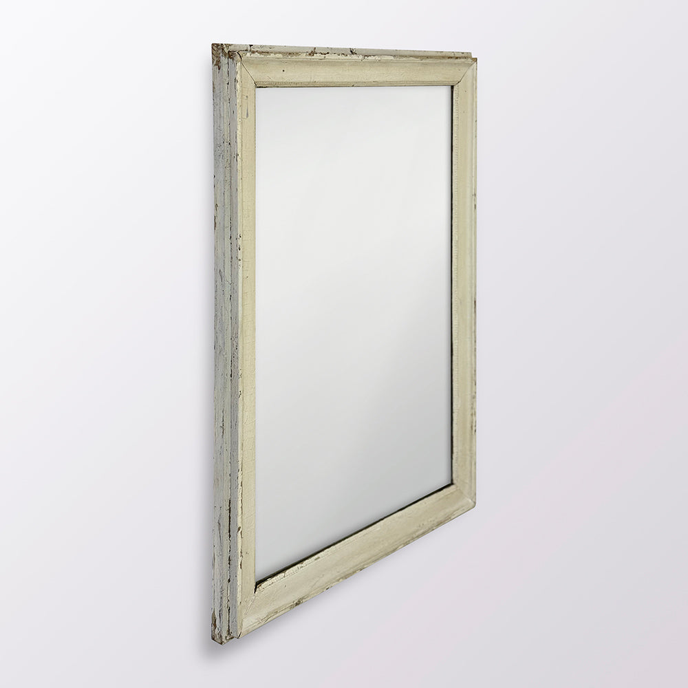 Rectangular mirror with a weathered wooden frame on a white background