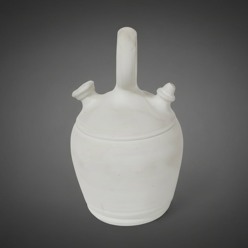 A charming antique French gargoulette from Provence, crafted in pale, unglazed terracotta with a softly weathered surface.