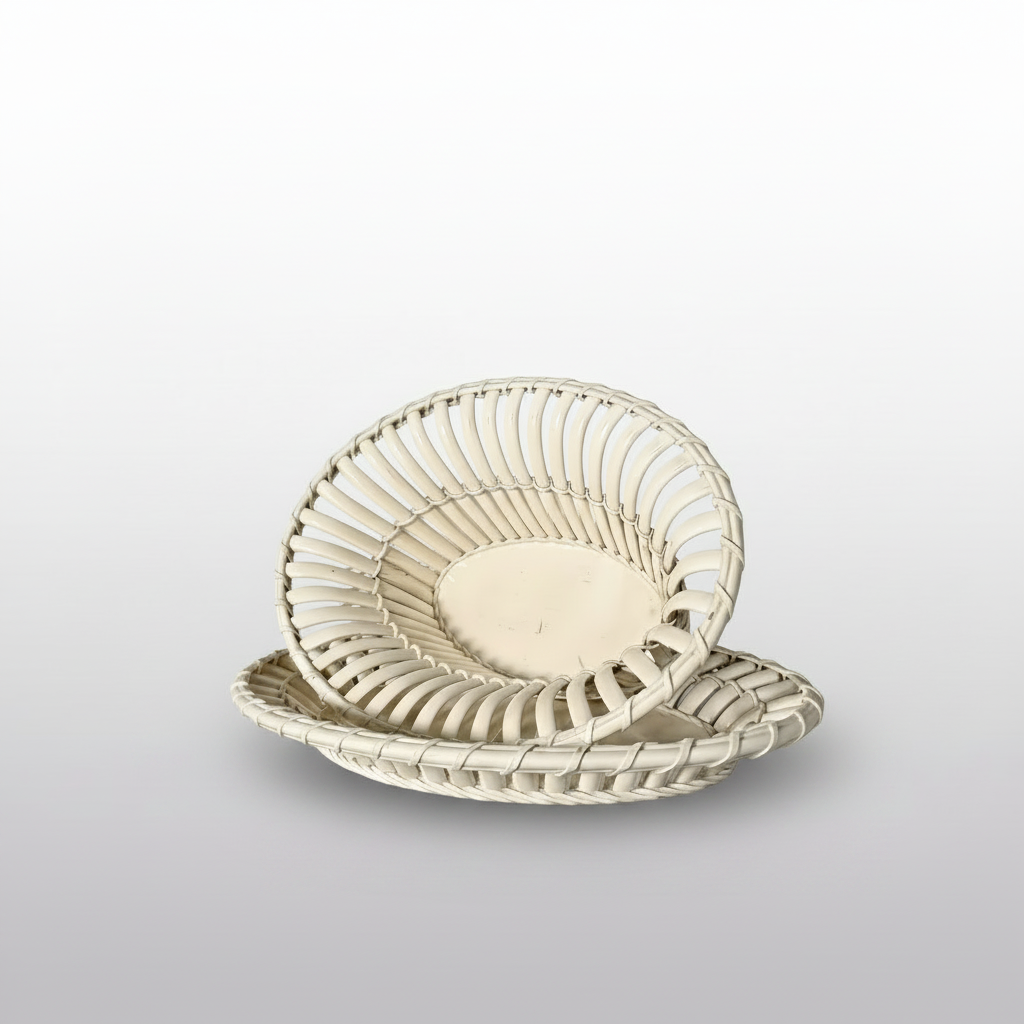 Two round woven baskets with open slatted sides, stacked slightly offset on a light gray gradient background.