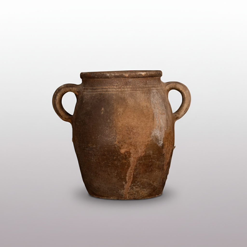 Brown ceramic jar with two handles on a dark background.