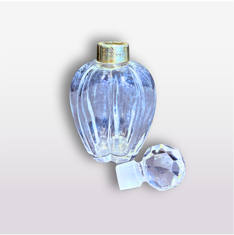 Ribbed glass scent bottle with sterling silver collar and faceted stopper