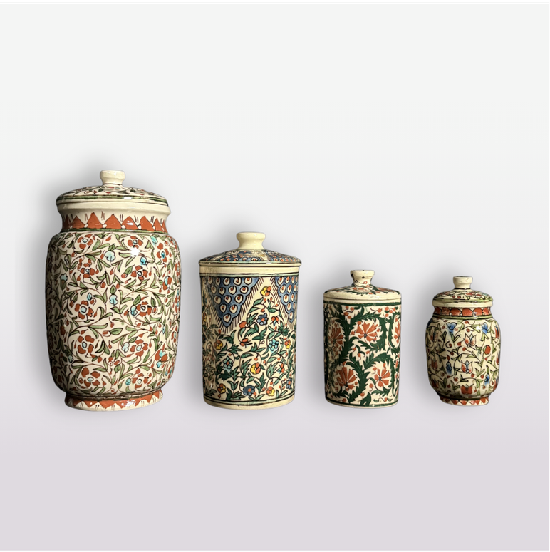 vintage handmade canister set of four with floral motif