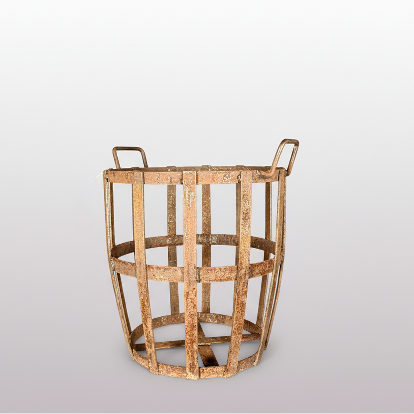 A rustic, vintage wooden basket with a natural light brown finish, featuring two loop handles on the sides, set against a dark gray backdrop.