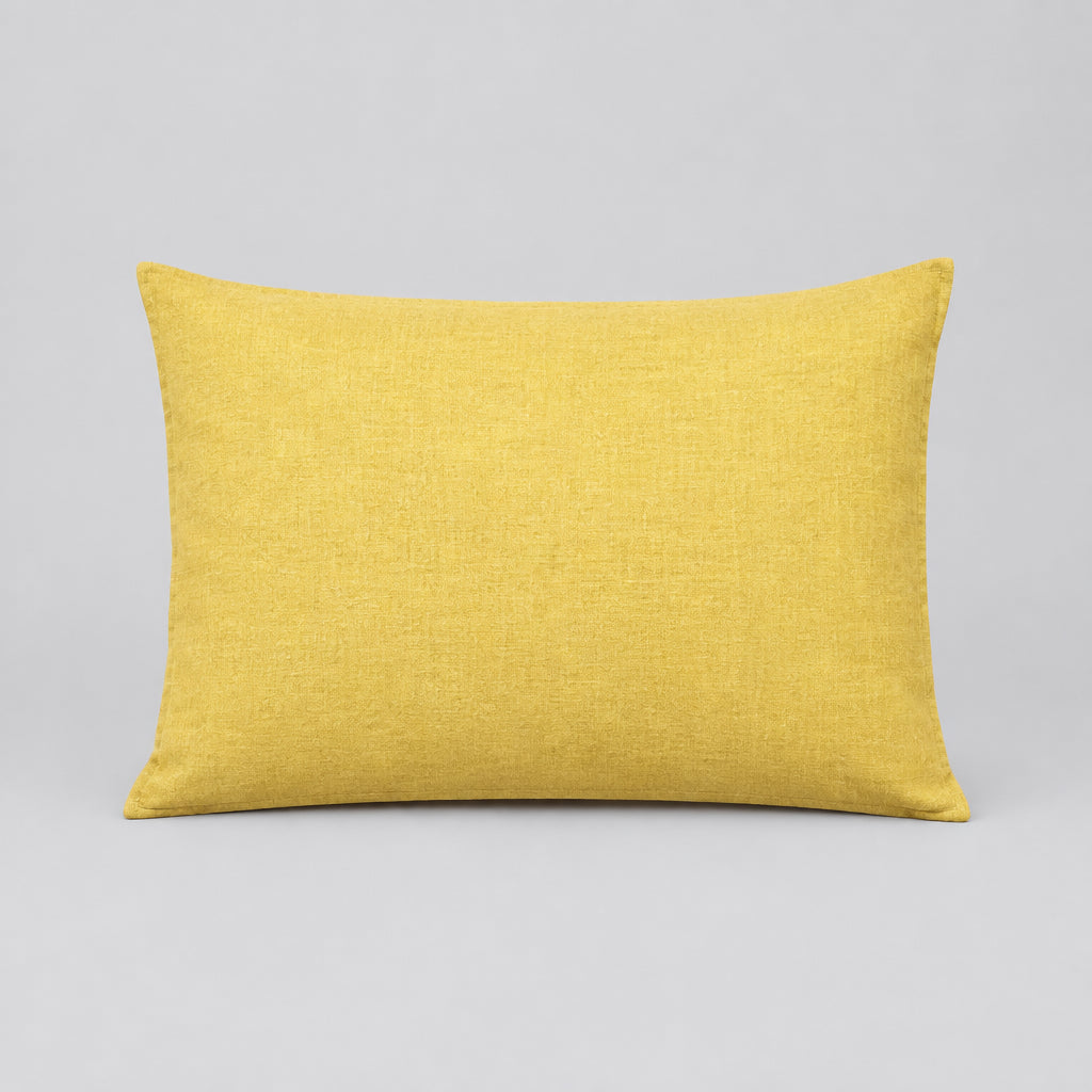 A rectangular yellow pillow shown against a plain white background.