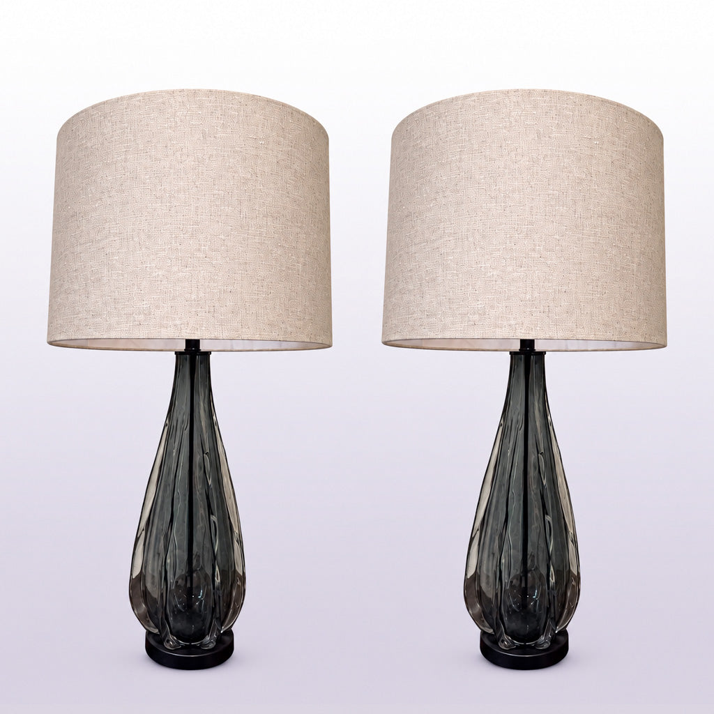 A pair of vintage table lamp bases in blue-grey blown glass with an organic sculpted teardrop form.