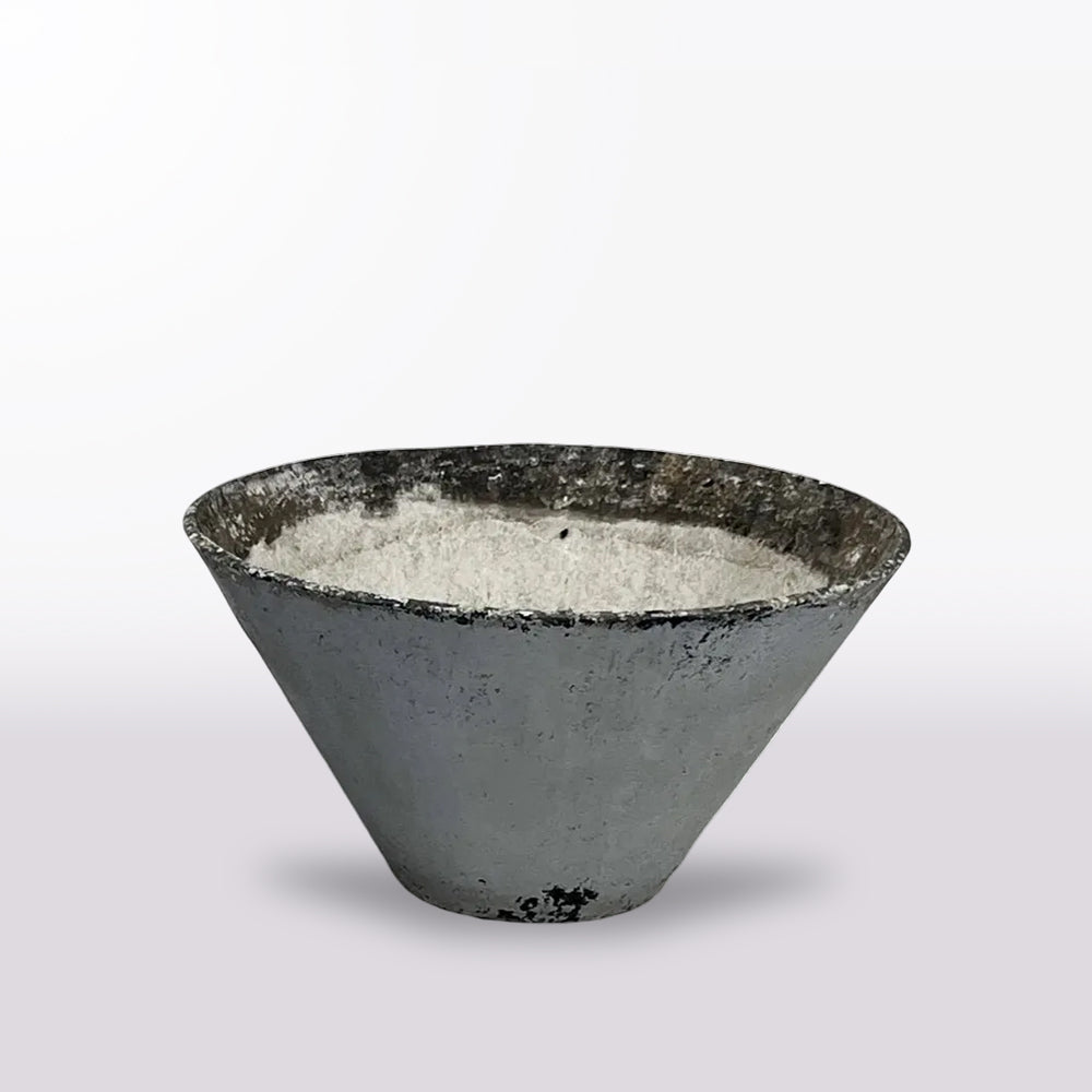 A large planter in cast concrete, its bold conical form and footless base in the minimalist, sculptural style of designer Willy Guhl.